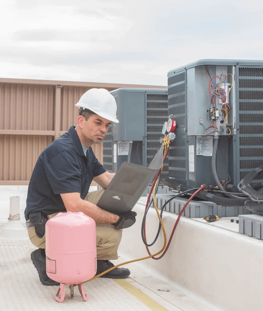 Air Conditioning repair technician fixing a unit in Victoria, TX-4