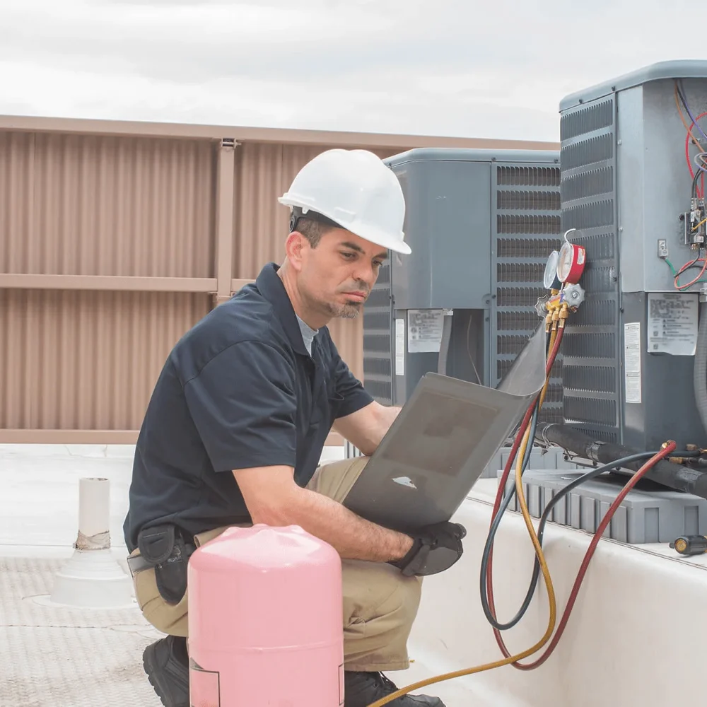 commercial-mobile Air Conditioning repair technician fixing a unit in Victoria, TX